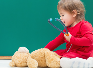 Child with Teddy Bear and Stethoscope Pediatrician Guide Featured Image
